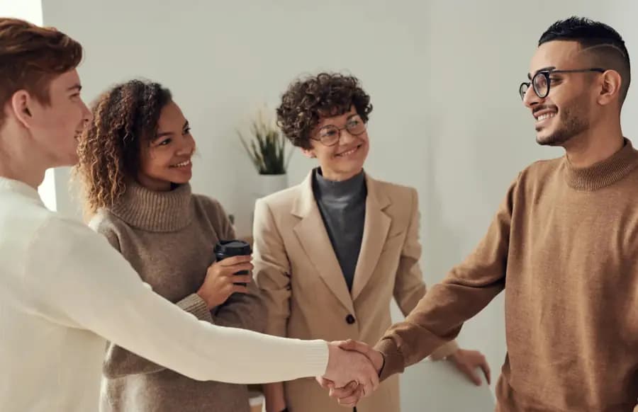 Team members shaking hands